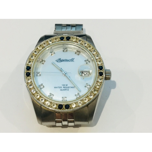 202 - An Aqua Marin wristwatch, with diamond set bezel on blue leather strap, multi dial face with deploym... 