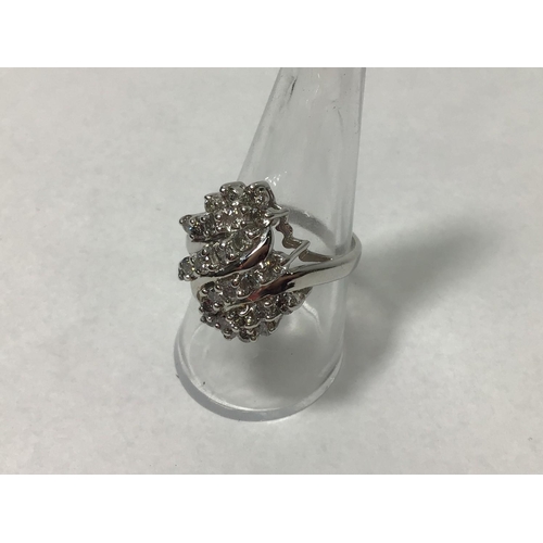 205 - A 14ct white gold twist design cluster ring, claw set with twenty six round brilliant-cut diamonds, ... 