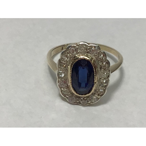 209 - A 9ct gold cluster ring, rubover set with a central oval sapphire surrounded by sixteen diamonds, th... 