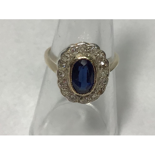 209 - A 9ct gold cluster ring, rubover set with a central oval sapphire surrounded by sixteen diamonds, th... 