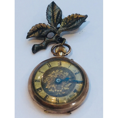 217 - A 9ct rose gold open face lady's pocket watch, roman numeral dial. Total weight including metal leaf... 