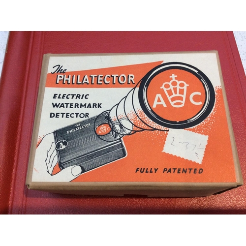 297 - A 'Philatector' electric watermark detector (boxed), together with an album of used 'Empire' and 'Wo... 