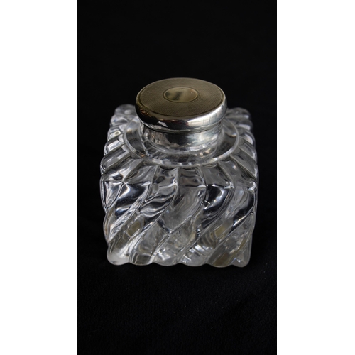 60A - A silver-topped glass ink bottle by Finnigans Ltd of Manchester, hallmarked London, 1916, 8.5cm tall