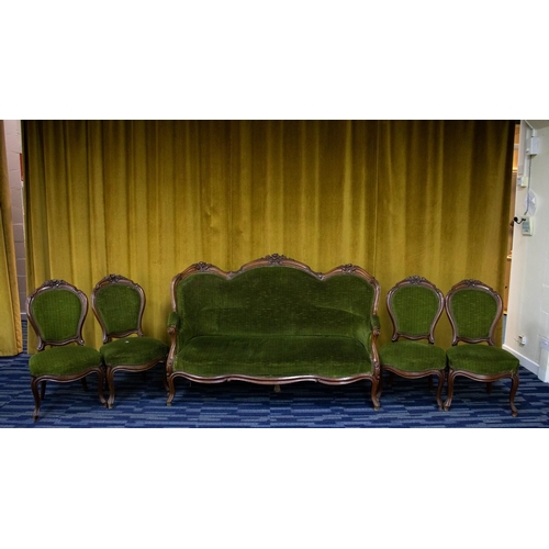 60C - A Victorian mahogany parlour suite comprising sofa and four chairs, each with carved floral decorati... 