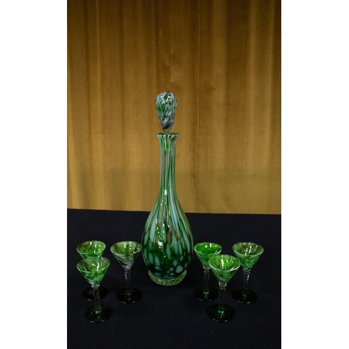 214C - A seven-piece marbled green and opaque white glass liqueur set with gold 'aventurine' flake inclusio... 