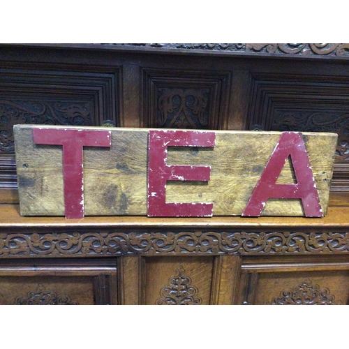 289B - A vintage 'Tea' sign with red painted metal letters on oak plinth, 79cm wide