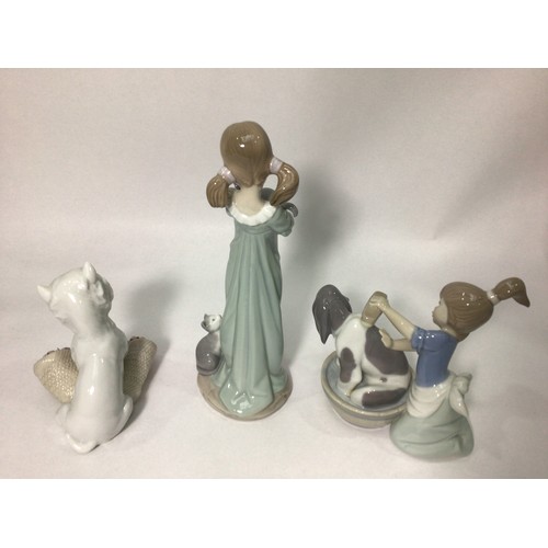 38 - Three various Lladro porcelain figures ‘Playful Character No. 8207’, ‘Bashful Bather No. 5455’, and ... 