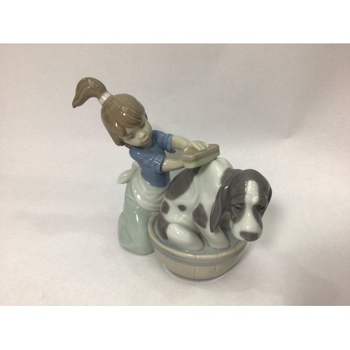 38 - Three various Lladro porcelain figures ‘Playful Character No. 8207’, ‘Bashful Bather No. 5455’, and ... 