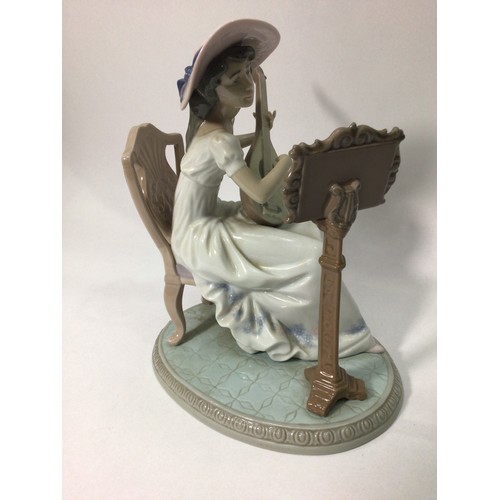 41 - A Lladro porcelain figure of a seated lady playing guitar with music stand, ‘Sweet Song No. 06408’, ... 