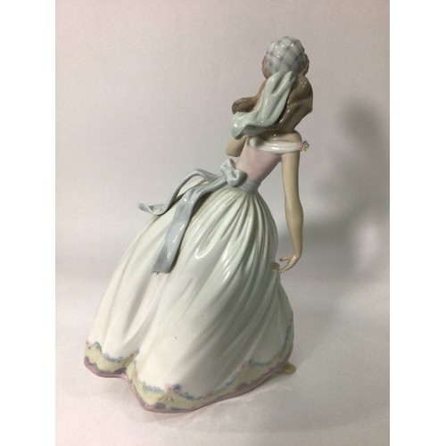 42 - A Lladro porcelain figure of Cinderella ‘The Glass Slipper No. 5957’, signed to base, 26cm high, in ... 