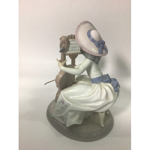 44 - A Lladro porcelain figure of a lady playing a cello with music stand, ‘Concerto No.6332’, signed to ... 