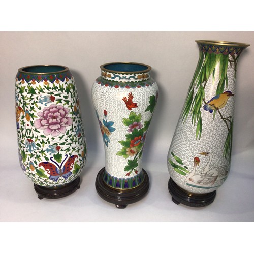 57 - Three various large cloisonné enamel vases on stands, decorated with flowers, birds and butterflies ... 