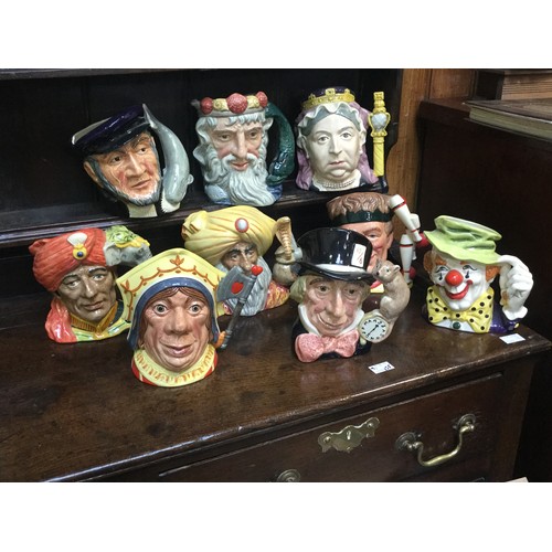 61 - Nine large Royal Doulton character jugs comprising Captain Ahab, D6500, Mad Hatter, D6598, The Red Q... 