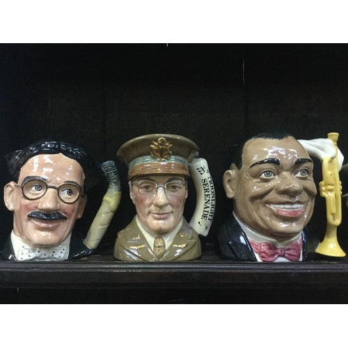 76 - A collection of large Royal Doulton character jugs, including Groucho Marx, Glenn Miller, Louis Arms... 