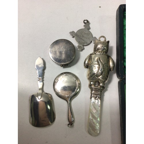 132 - Various silver items including a rattle in the form of a cat, miniature silver-backed hand mirror, S... 