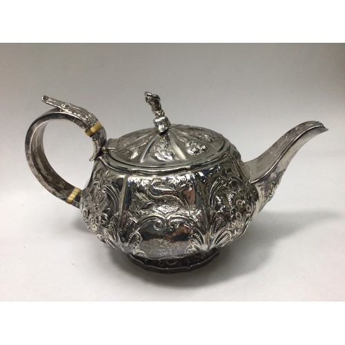 139 - George IV silver teapot of compressed globular form with vertical panelled sides, embossed with scro... 