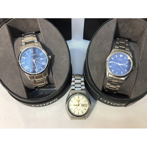 177 - Three assorted gents stainless steel wristwatches comprising a Seiko 5 automatic with English/French... 