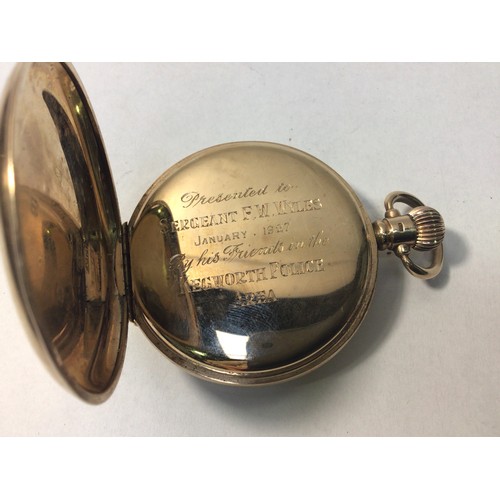 184 - A 9ct gold cased Waltham half-hunter pocket watch, the case front with circular window surrounded by... 