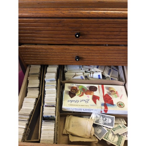 239 - An extensive collection of vintage cigarette cards, loose in bundles and within a three drawer table... 