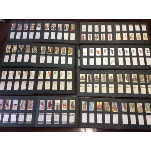 240 - An extensive collection of 're-issue' cigarette cards, loose in 16x 'vintage' gilt-tooled albums, to... 