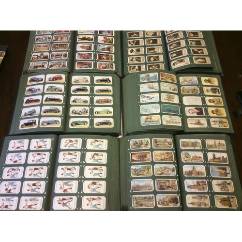 245 - A large collection of cigarette cards comprising six albums approximately 6000 cards in sets and all... 