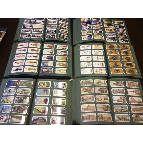 245 - A large collection of cigarette cards comprising six albums approximately 6000 cards in sets and all... 