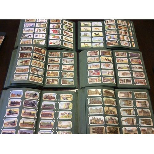 245 - A large collection of cigarette cards comprising six albums approximately 6000 cards in sets and all... 