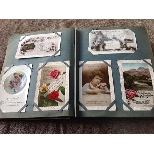 252 - An original old album of approximately 263 greetings postcards - mainly Edwardian but also some earl... 