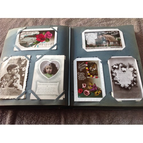 252 - An original old album of approximately 263 greetings postcards - mainly Edwardian but also some earl... 