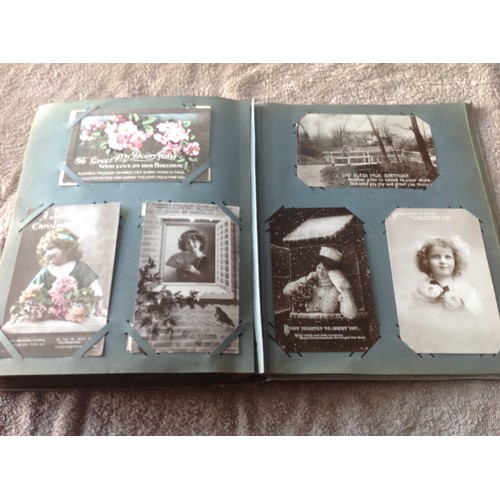 252 - An original old album of approximately 263 greetings postcards - mainly Edwardian but also some earl... 