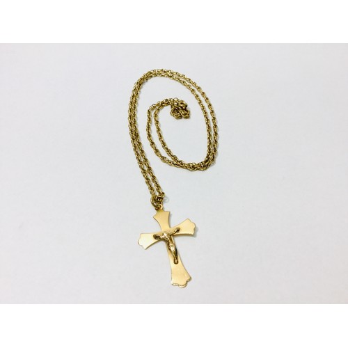 195 - A 9ct yellow gold chain measuring 24 inches, with a 9ct yellow gold crucifix, total weight 7.6 grams... 