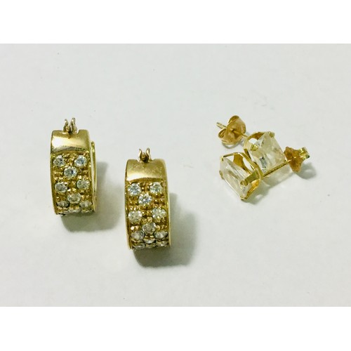 219 - A pair of 9ct yellow gold earrings, pave set with white stones, weighing 4.7 grams. Together with a ... 