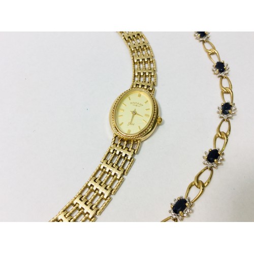 227 - A 9ct yellow gold oval face wristwatch weighing 15.7 grams. Together with a 9ct yellow gold Australi... 