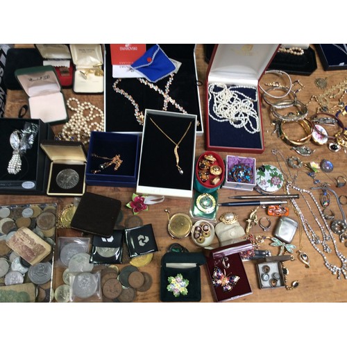 229 - A collection of costume jewellery including a Swarovski necklace, freshwater pearls, various brooche... 