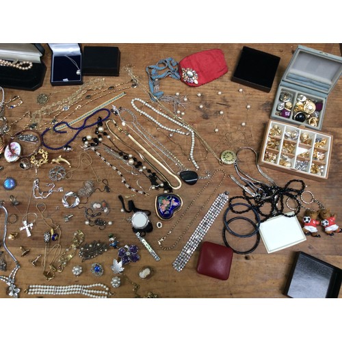 229 - A collection of costume jewellery including a Swarovski necklace, freshwater pearls, various brooche... 