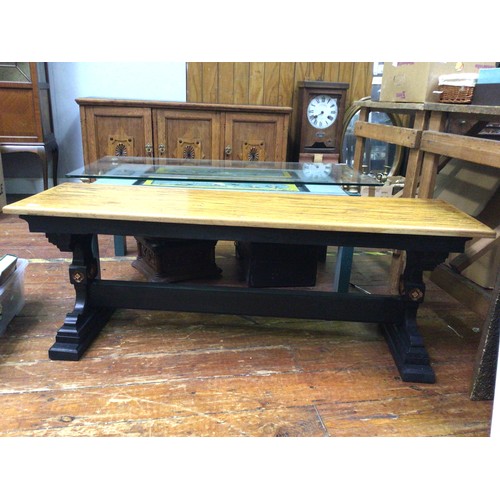 421 - An oak bench / seat with black painted legs and stretcher with carved detail and red and gilt painte... 