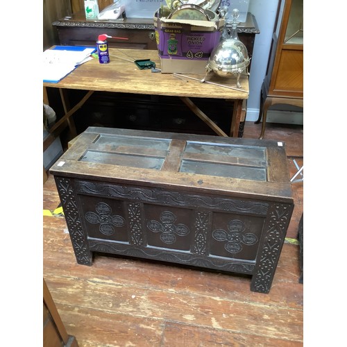 419 - A 17th century stained oak coffer, with carved guilloche, lunette and strapwork decoration to the fr... 