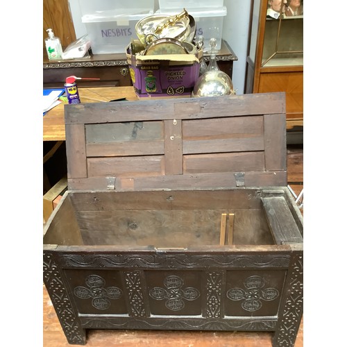 419 - A 17th century stained oak coffer, with carved guilloche, lunette and strapwork decoration to the fr... 