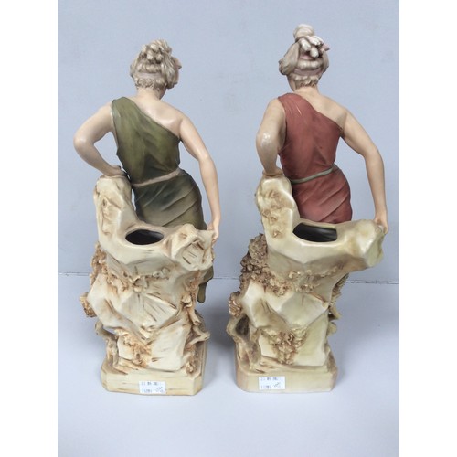 36 - Two matching Royal Dux porcelain figural spill vases modelled as classical maidens, each sat atop a ... 
