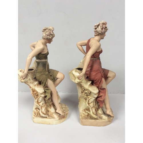 36 - Two matching Royal Dux porcelain figural spill vases modelled as classical maidens, each sat atop a ... 