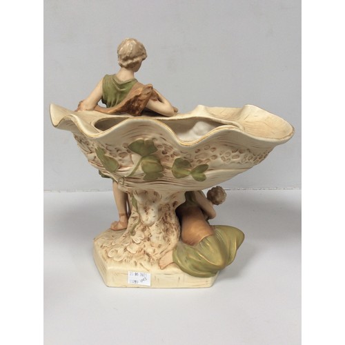 38 - A Royal Dux porcelain centrepiece vase modelled as a classical male figure wearing a goatskin, with ... 