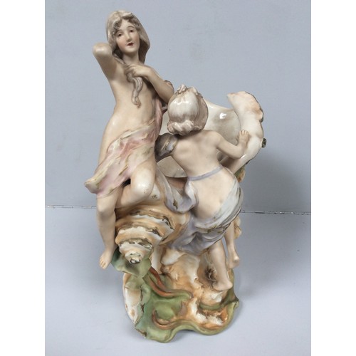40 - A Royal Dux porcelain figural centrepiece modelled as a conch shell vase mounted with two semi-naked... 