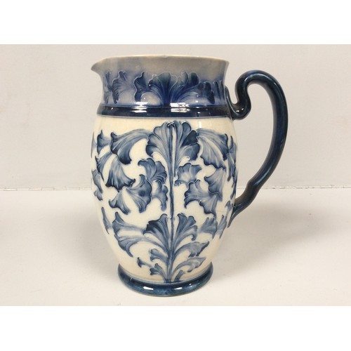 42 - A Macintyre Florian Ware pottery jug with tube-lined and blue glazed floral decoration, Reg No.38855... 