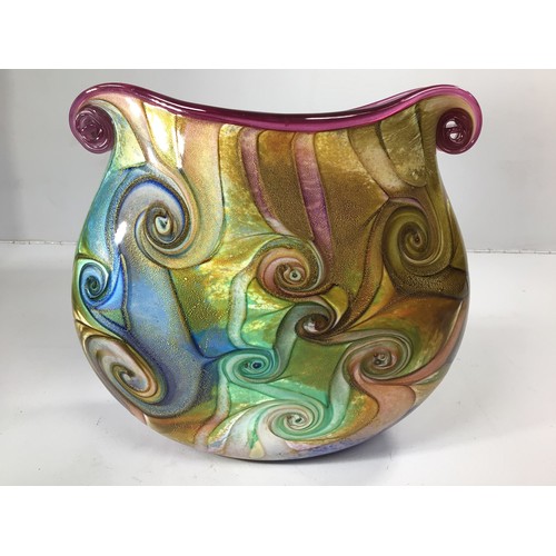 61 - An Isle of Wight studio glass oval vase with twin scrolled ends, decorated with a swirl design in hu... 
