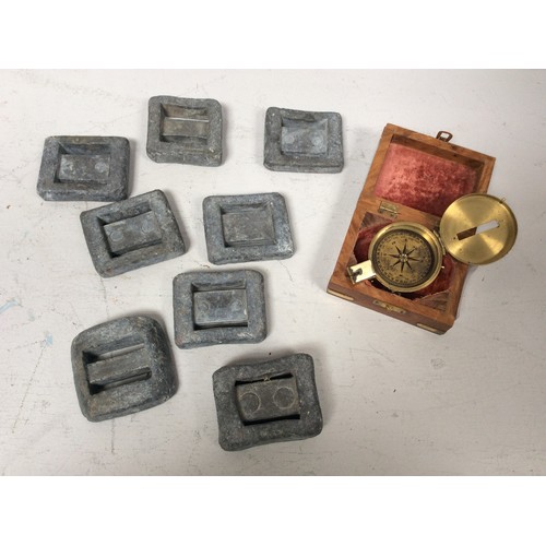 271 - Eight sea diver's lead belt weights, together with a brass hand-held field compass in brass-bound te... 