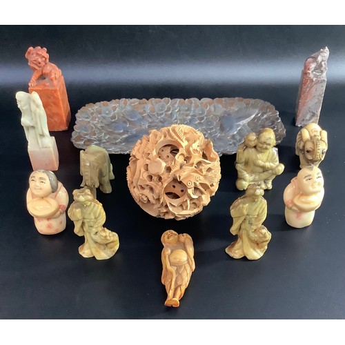 322 - A Chinese boxwood carved puzzle ball, together with a Japanese copper hammered dish with birds amids... 