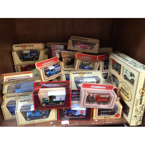 326 - SECTION 55. A collection of approximately 50 boxed die-cast model vehicles, largely Lledo Days Gone ... 