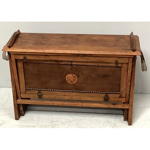 421 - An early 20th century officer's oak and canvas folding concertina campaign bed, 'The Cabinetta' by W... 