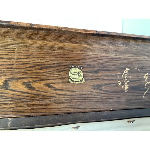 421 - An early 20th century officer's oak and canvas folding concertina campaign bed, 'The Cabinetta' by W... 