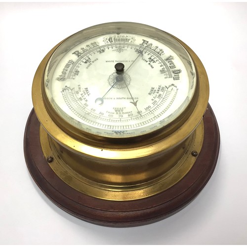 423 - A brass cased ship’s bulkhead barometer with white enamel dial marked ‘Whyte Thomson & Co, Glasgow &... 